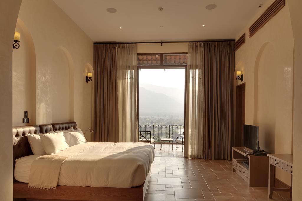 Toscana Town Square Suites Muszi Kültér fotó